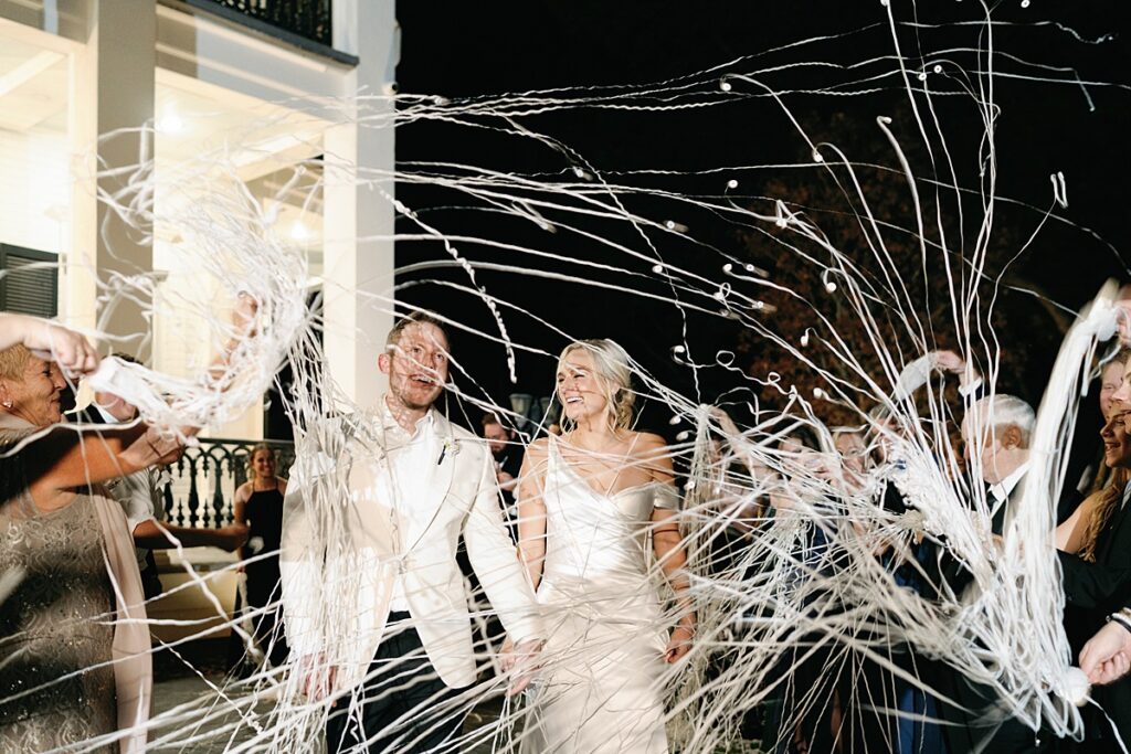 Streamer wedding sendoff at Sandlewood Manor with cheering guests